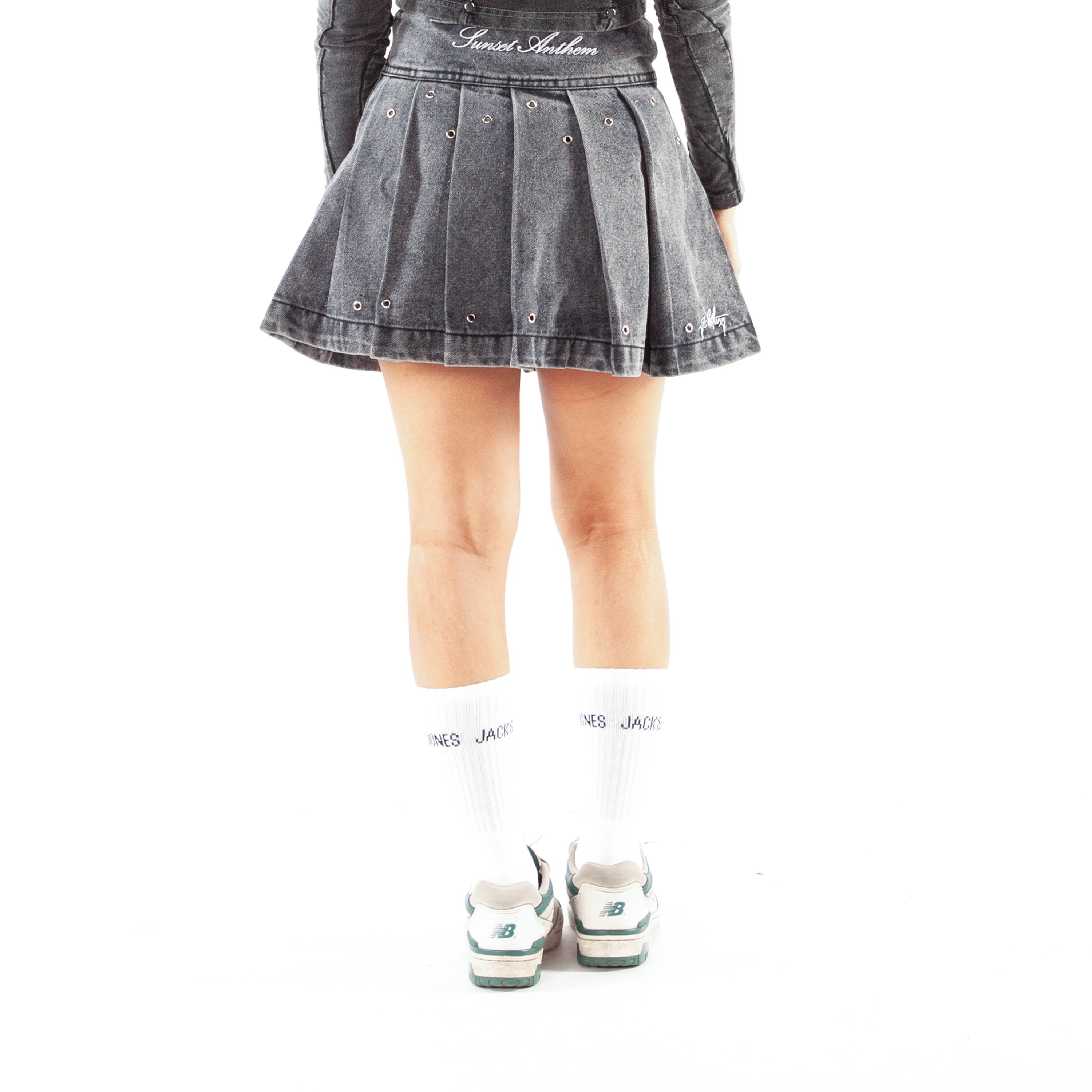 JCOLLINS Pleated Denim Skirt back — longer silhouette